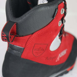 Close-up of Arbpro Cervino Wood red chainsaw boots designed for tree surgeons, showcasing no metal hooks and durable material.