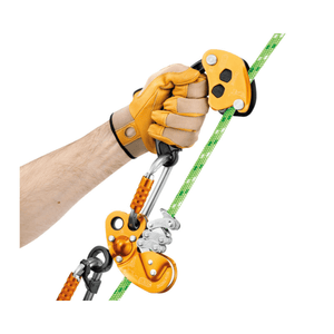 Person using PETZL CHICANE auxiliary brake on a green rope, ideal for tree surgeons enhancing control during single rope work.