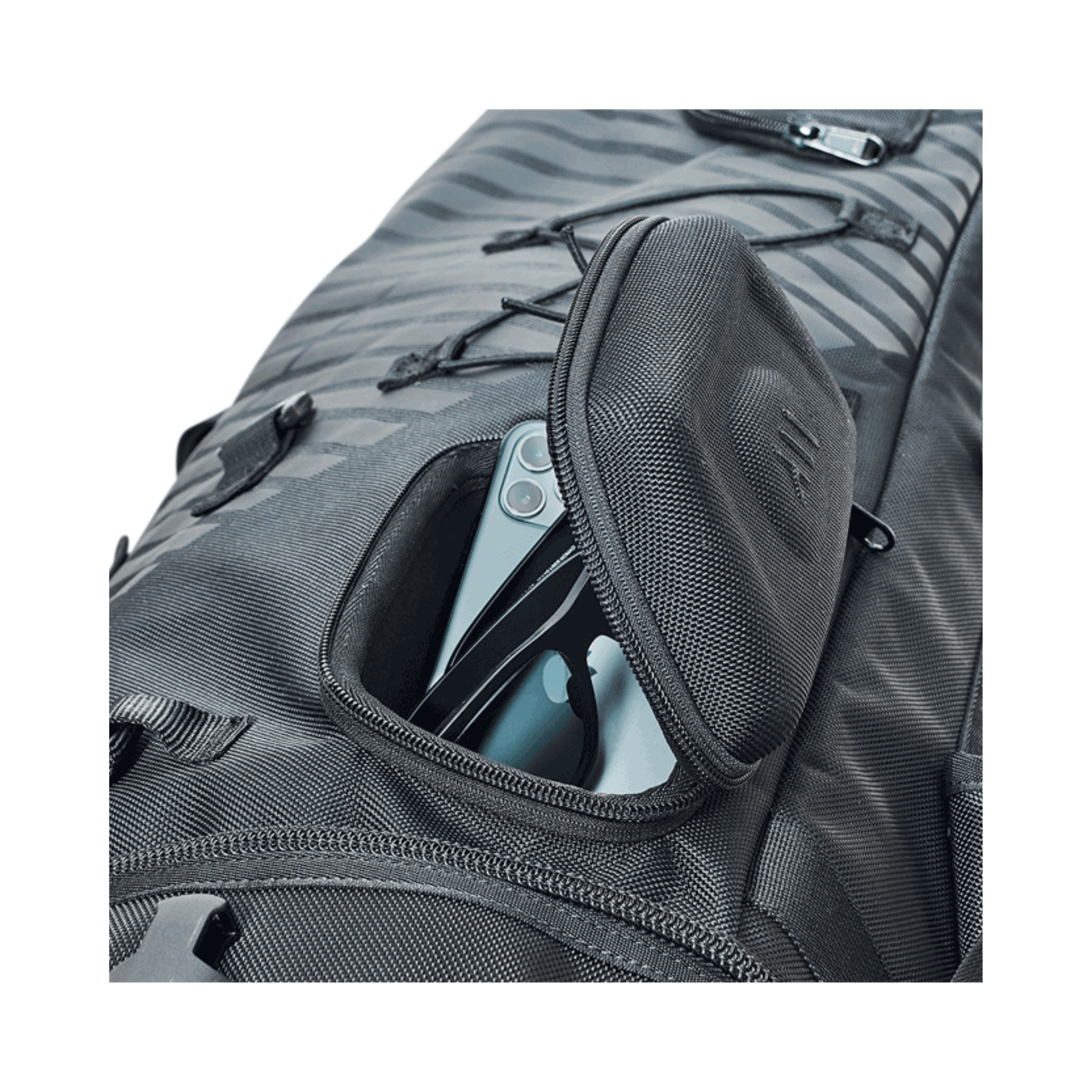 Close-up of Courant Cross Pro XL Rescue Bag All Black's pocket with smartphone visible.