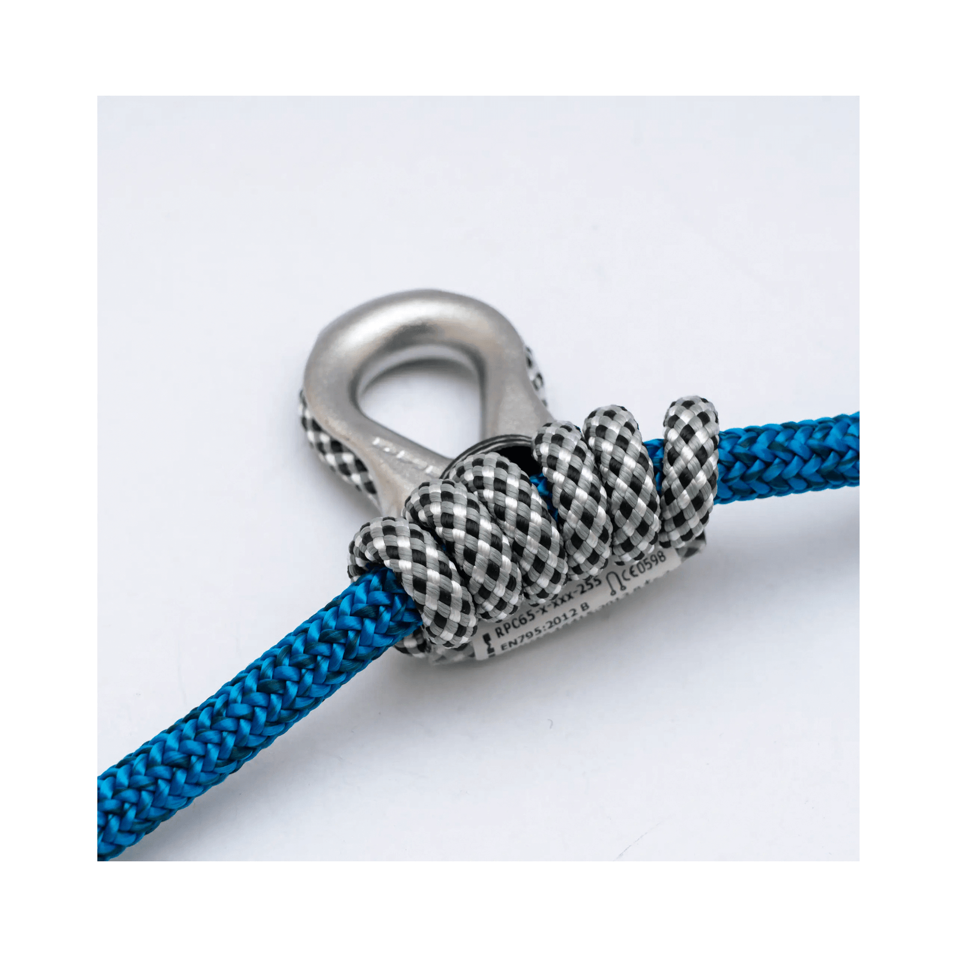 Close-up of the Nomad Friction Hitch Lanyard System with blue rope and a precise hitch knot.