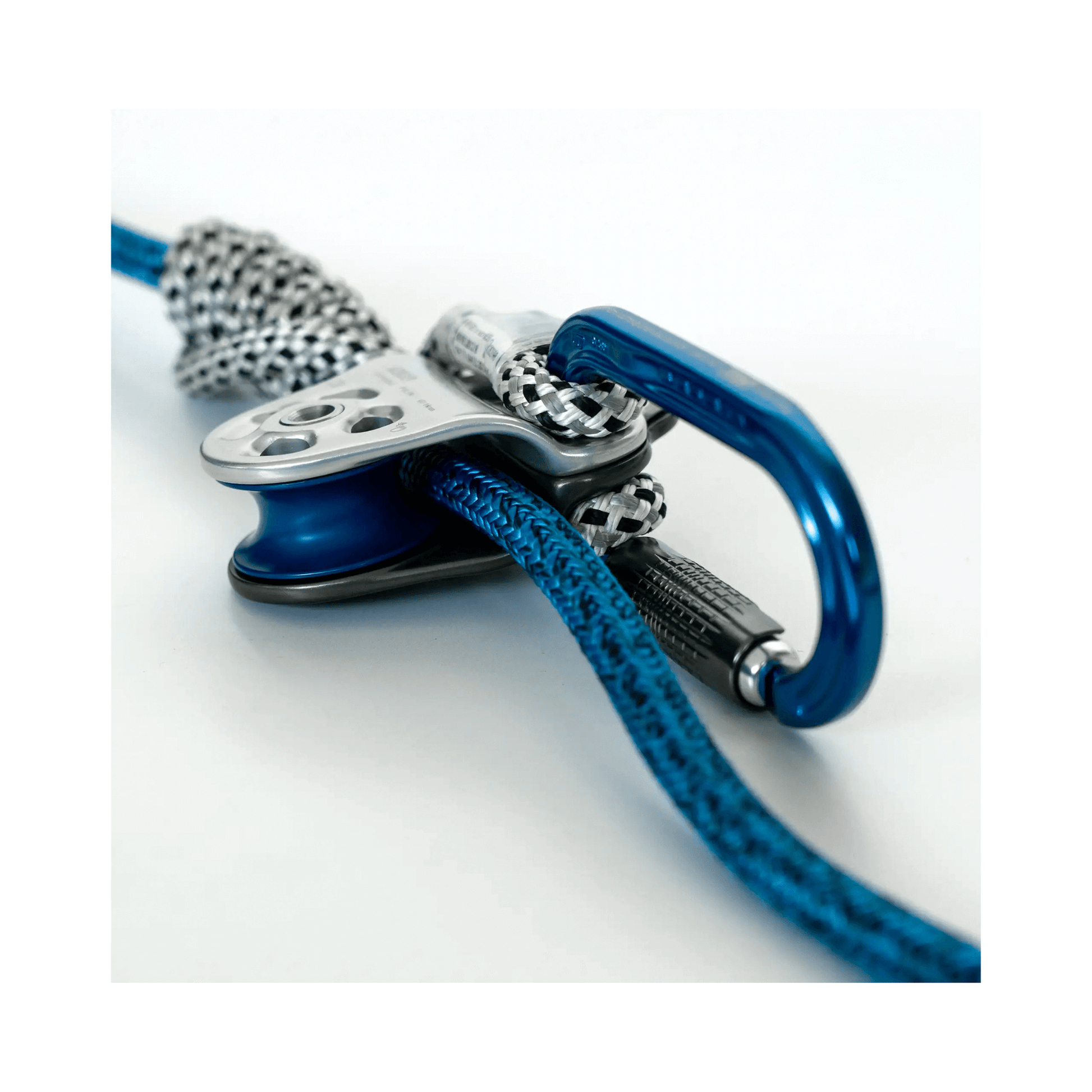 Close-up of the Nomad Friction Hitch Lanyard System featuring carabiner and rope for precision climbing.