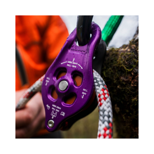 DMM Pinto Rig 2 Pulley in use, showcasing its high-efficiency and compact design for advanced climbing applications.