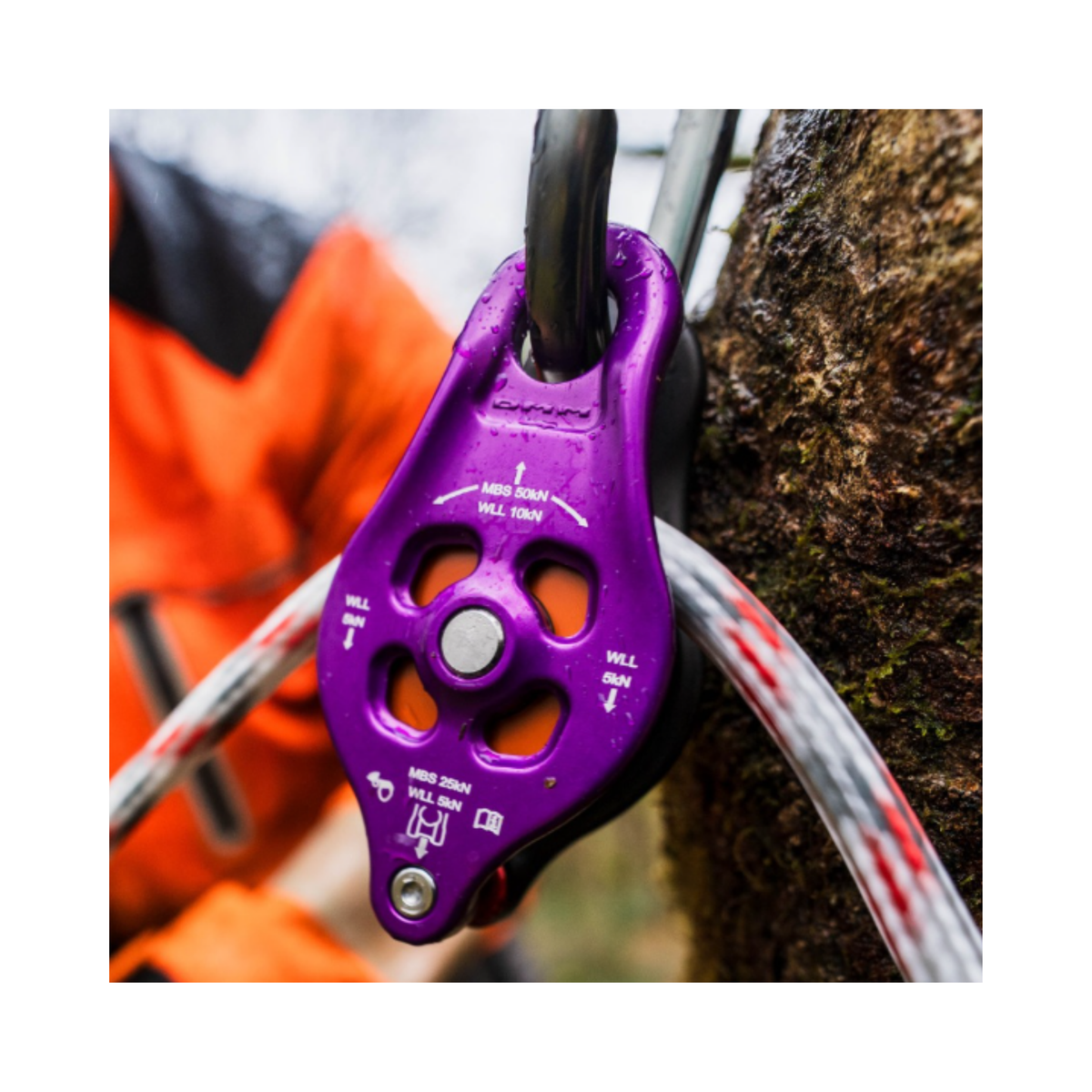 DMM Pinto Rig 2 Pulley in use, featuring sealed ball bearings and a compact design for efficient climbing and rigging.