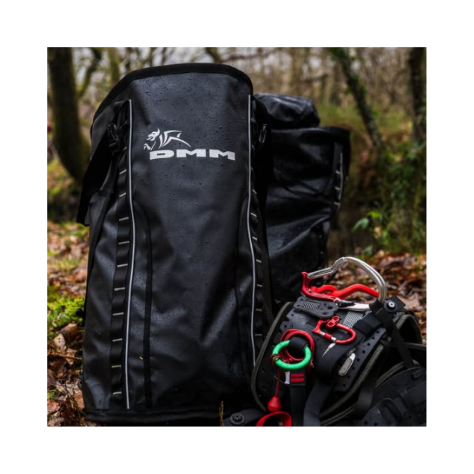 DMM Porter Rope Bag shown in a wet environment with climbing gear nearby, designed for heavy-duty use.