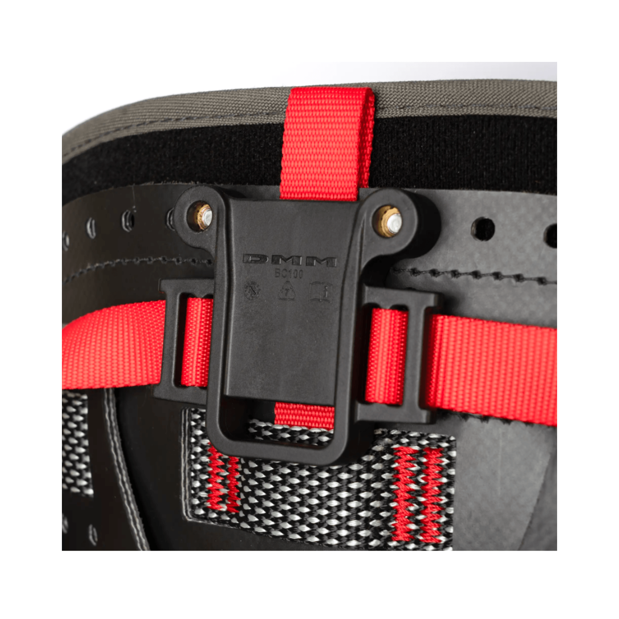DMM Caiman Harness Strap with red adjustment straps and secure attachment clip for climbing gear.