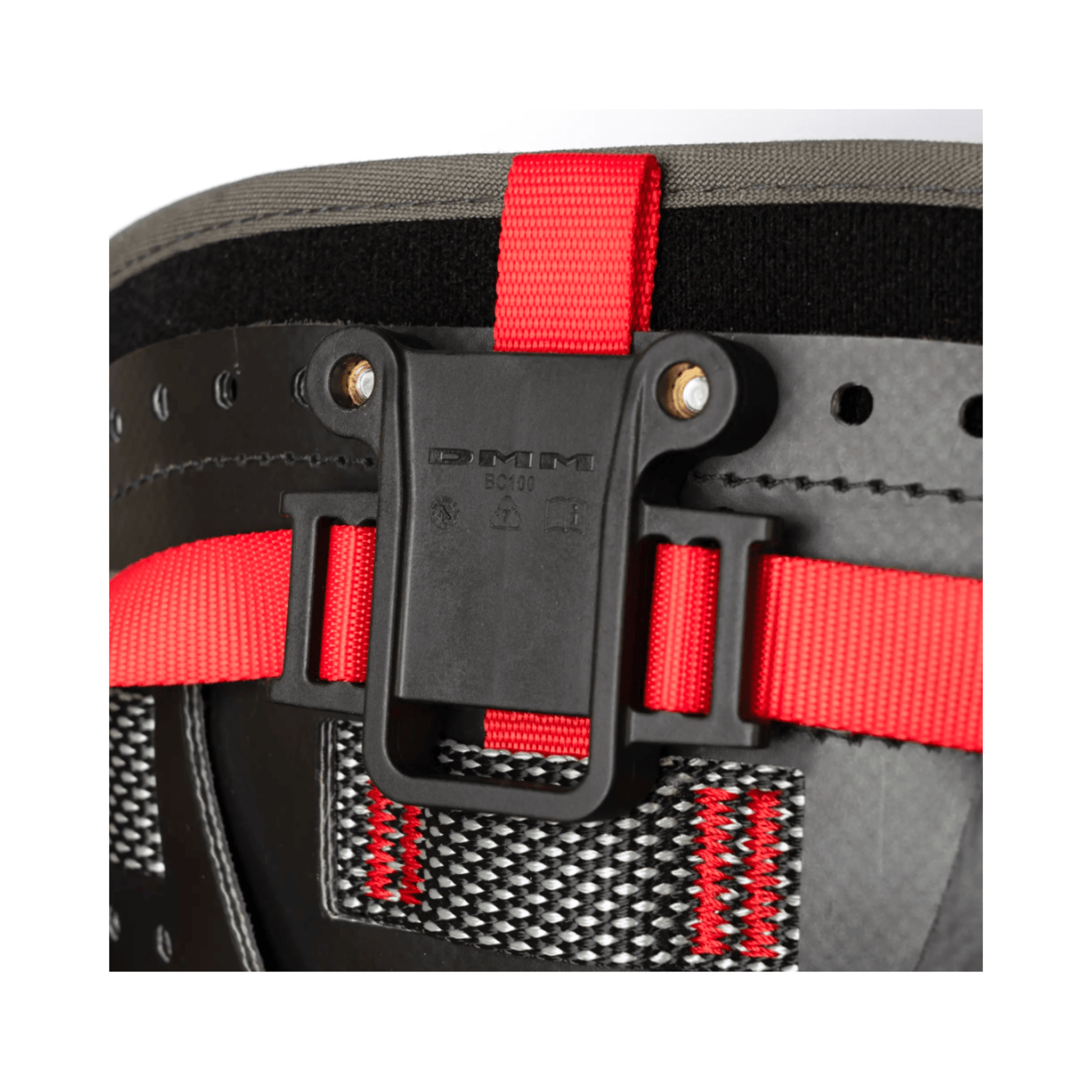 DMM Caiman Harness Strap with red adjustment straps and secure attachment clip for climbing gear.