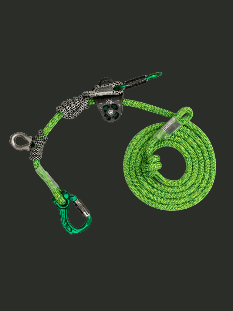 Green climbing rope with carabiners and pulley system for outdoor adventures and safety.