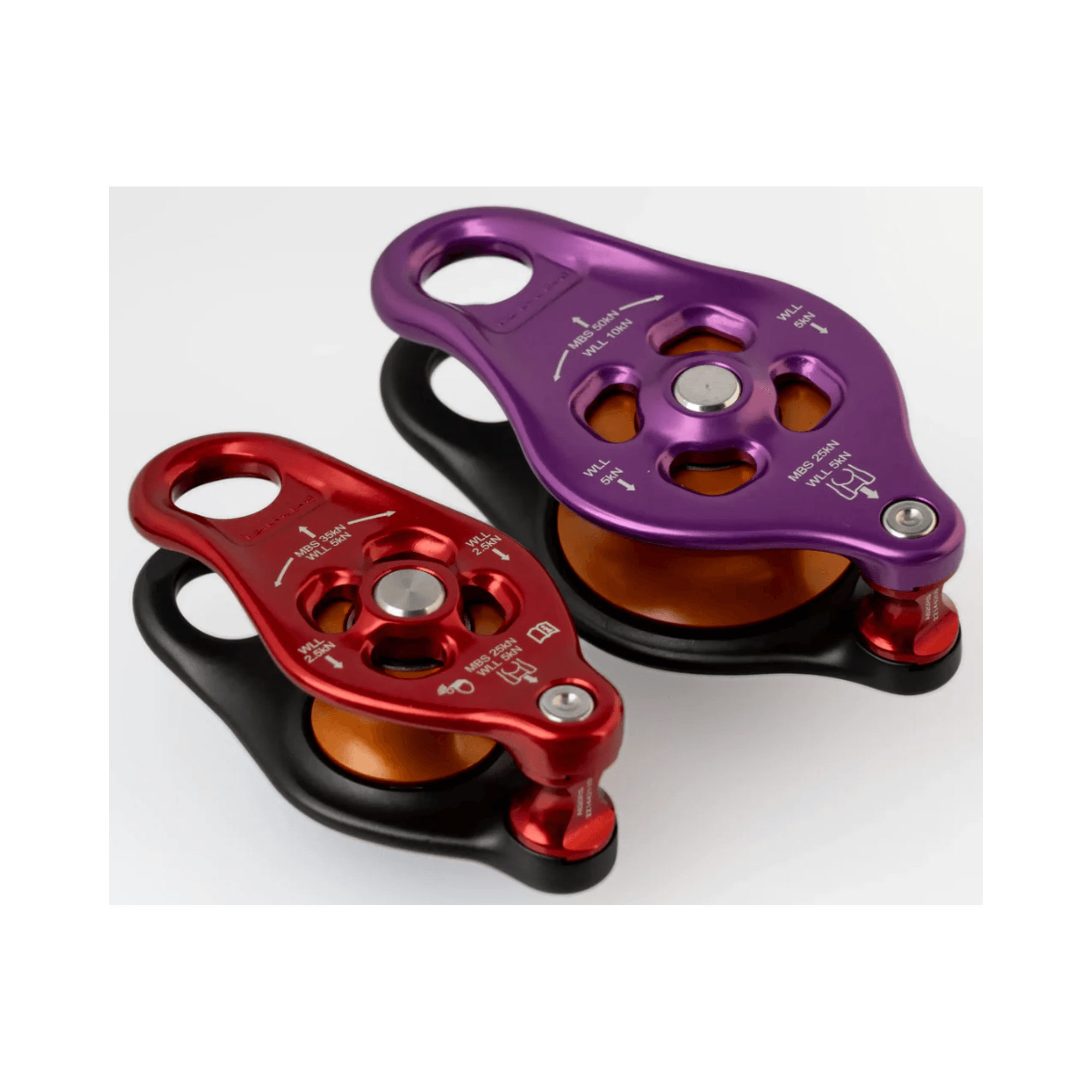 DMM Pinto 2 Pulley in red and purple, showcasing compact design for tree care and rope systems.
