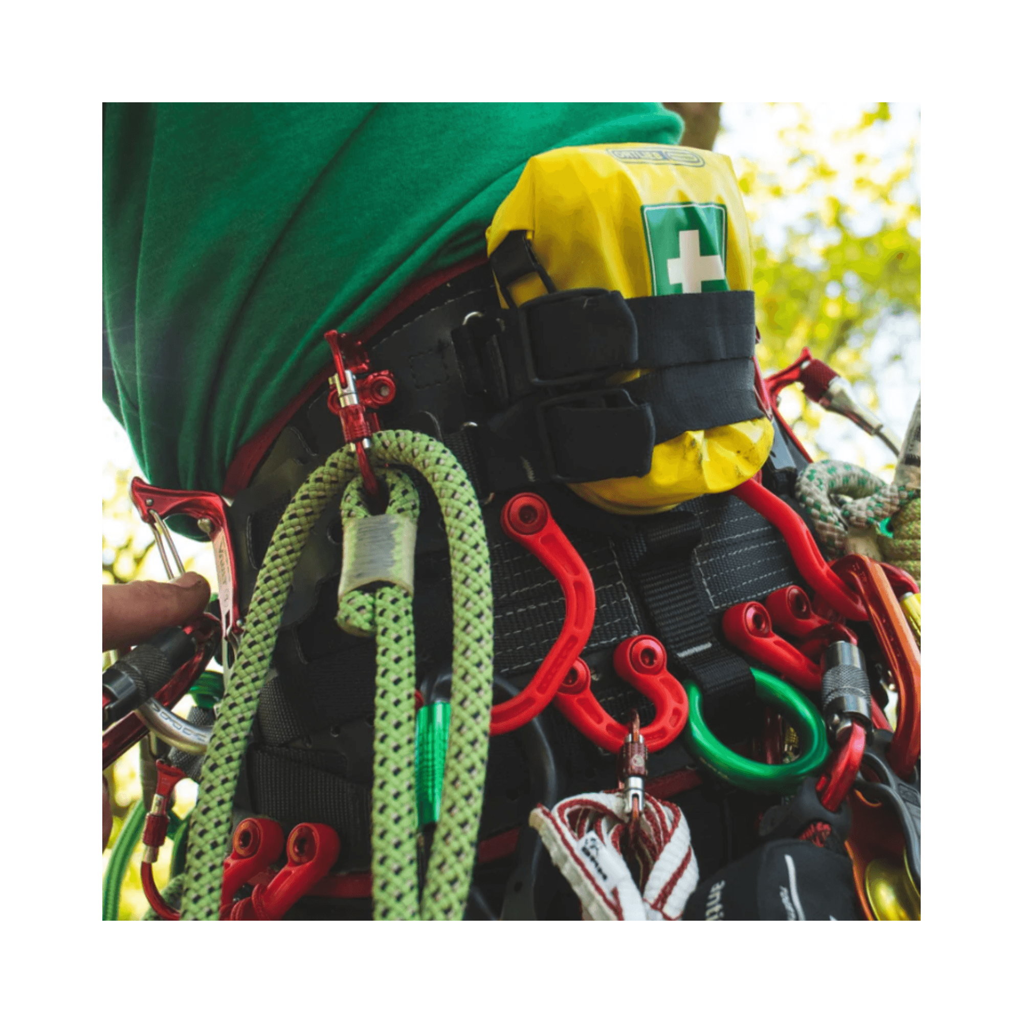 DMM Stowaway Storage Loops attached to a climbing harness, showcasing a flexible storage solution for tools and accessories.