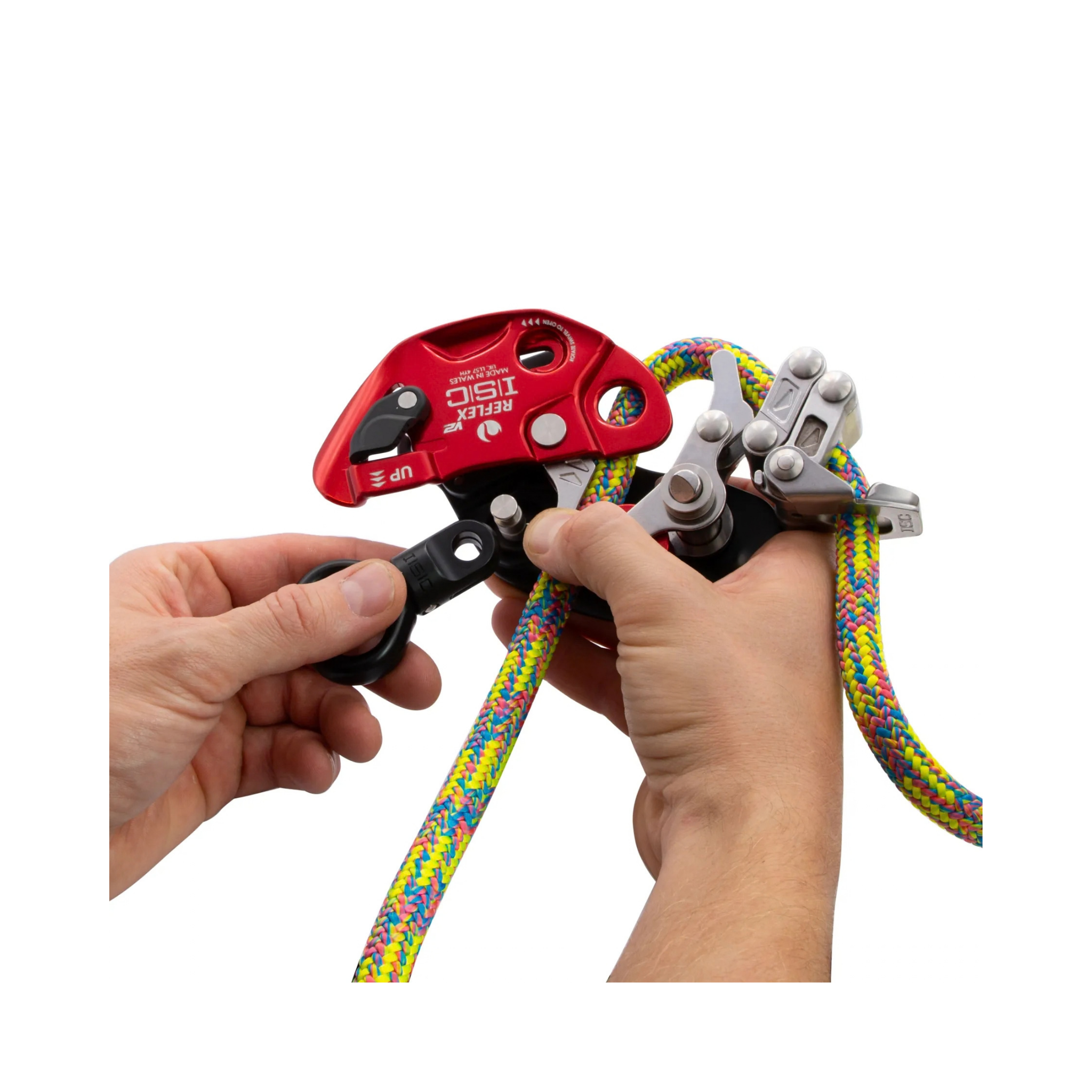 Hand holding the ISC MH285 REFLEX V2 Mechanical Hitch with colorful rope for arborists and rope-access professionals.