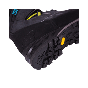 Close-up of Kayo Black Chainsaw Boots sole, showcasing durable traction and safety features for tree surgeons.