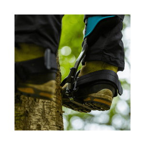 Steel Climbers attached to boots, showcasing ergonomic design for tree climbing stability and comfort.