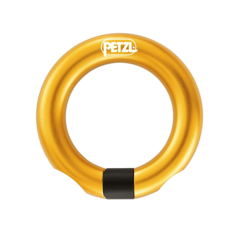 A gold-colored Petzl open gated ring for harnesses, with a black strap