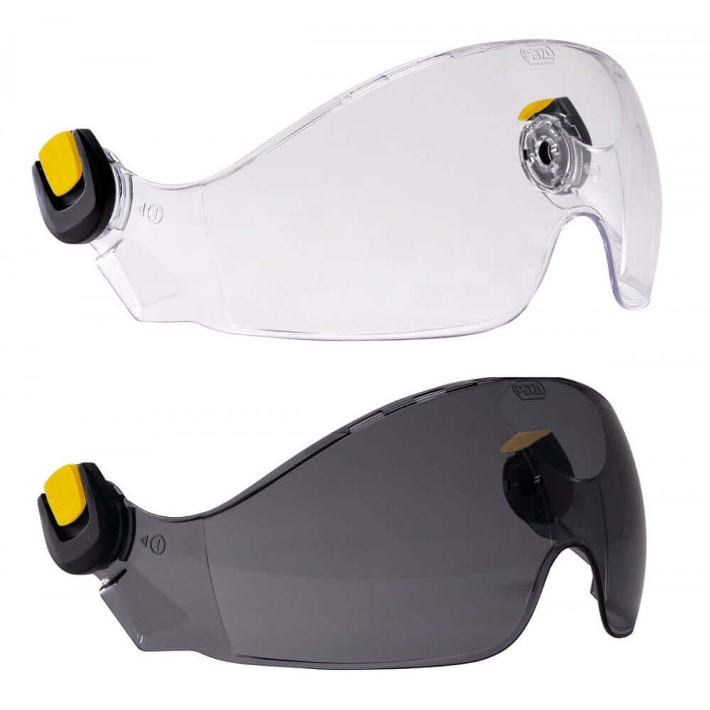 Two versions of the Petzl Vizir Eye Shield, one with a clear shield and one with a dark tinted shield, both attached to yellow and black helmet accessories.