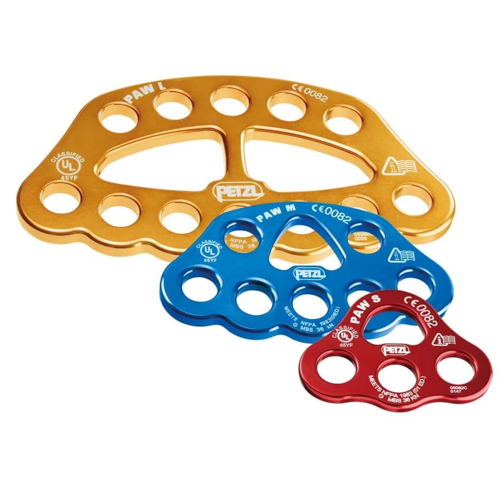 Three Petzl Paw Rigging Plates in gold, blue, and red colors, made of aluminum with multiple holes for carabiner locking sleeves.