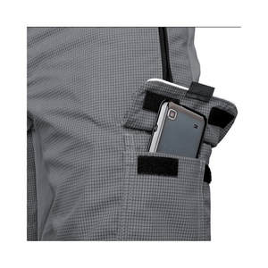 Close-up of a pocket in Ventilation Chainsaw Trousers Type A with a phone securely stored inside.