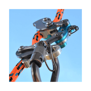 Akimbo Belay Device attached to colorful climbing rope, showcasing its design for efficient climbing systems.