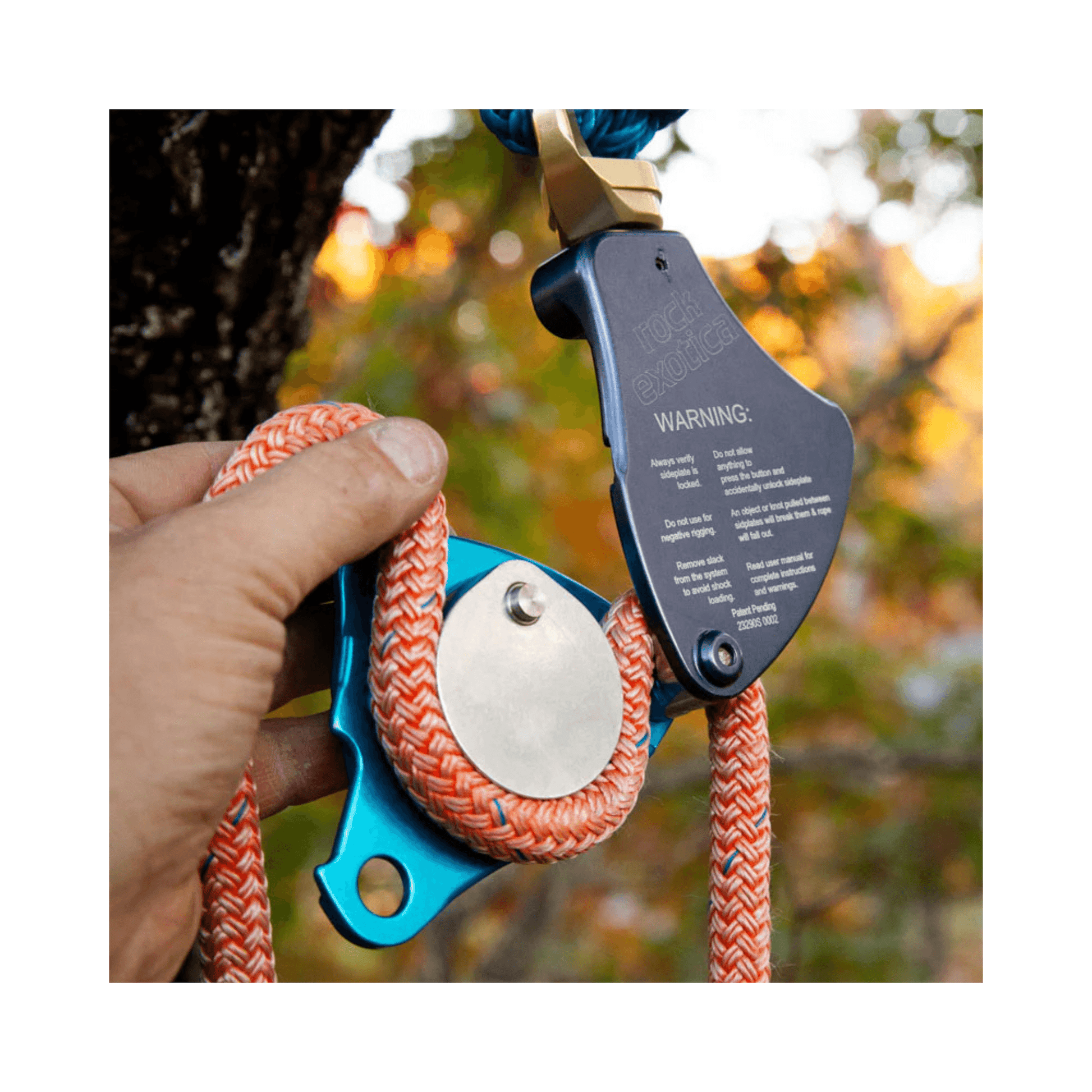 Rock Exotica DownRigger Pulley in use, showcasing its aerial friction capabilities for controlled descents.