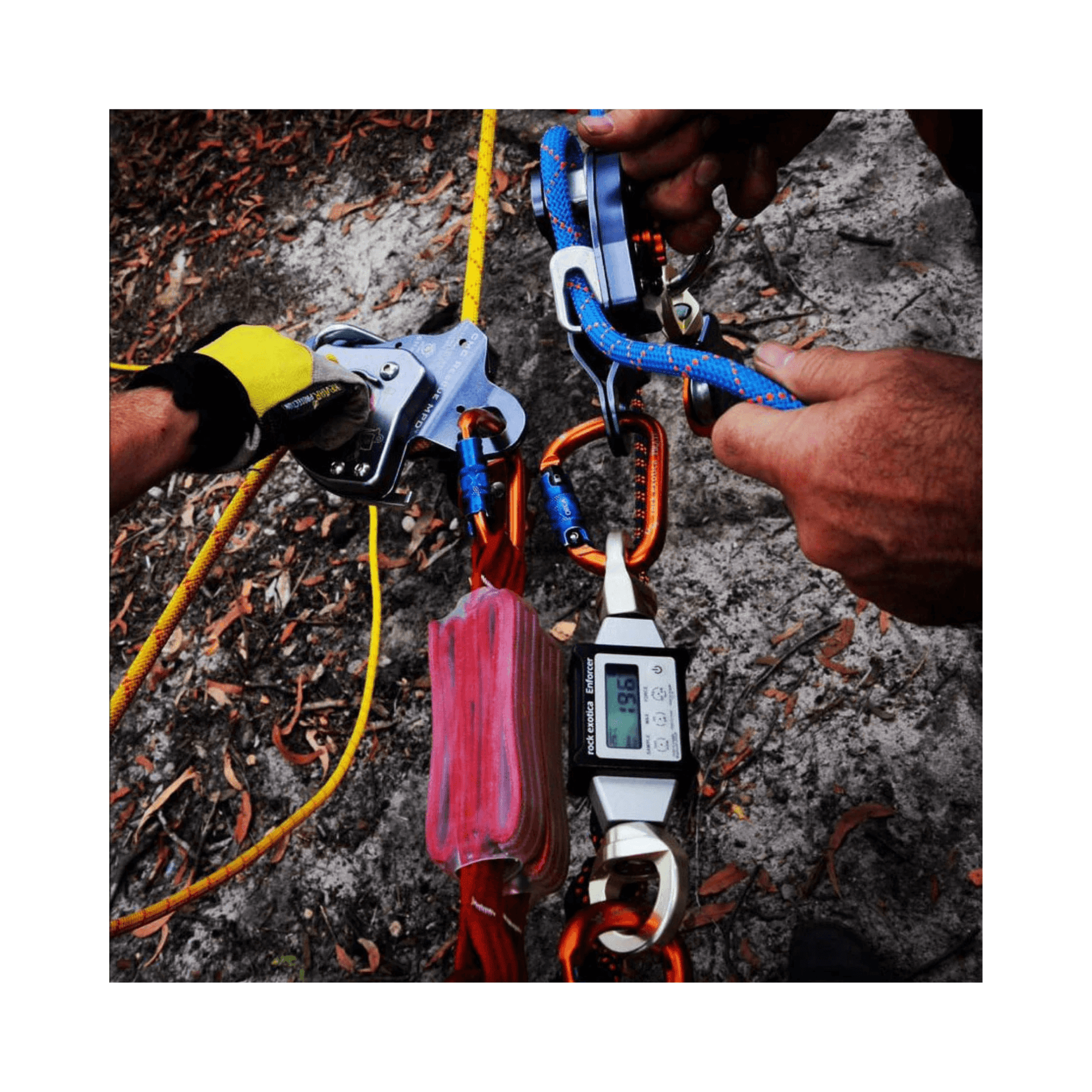 Hands using the Enforcer Load Cell & Case during a rigging operation for accurate force measurement.