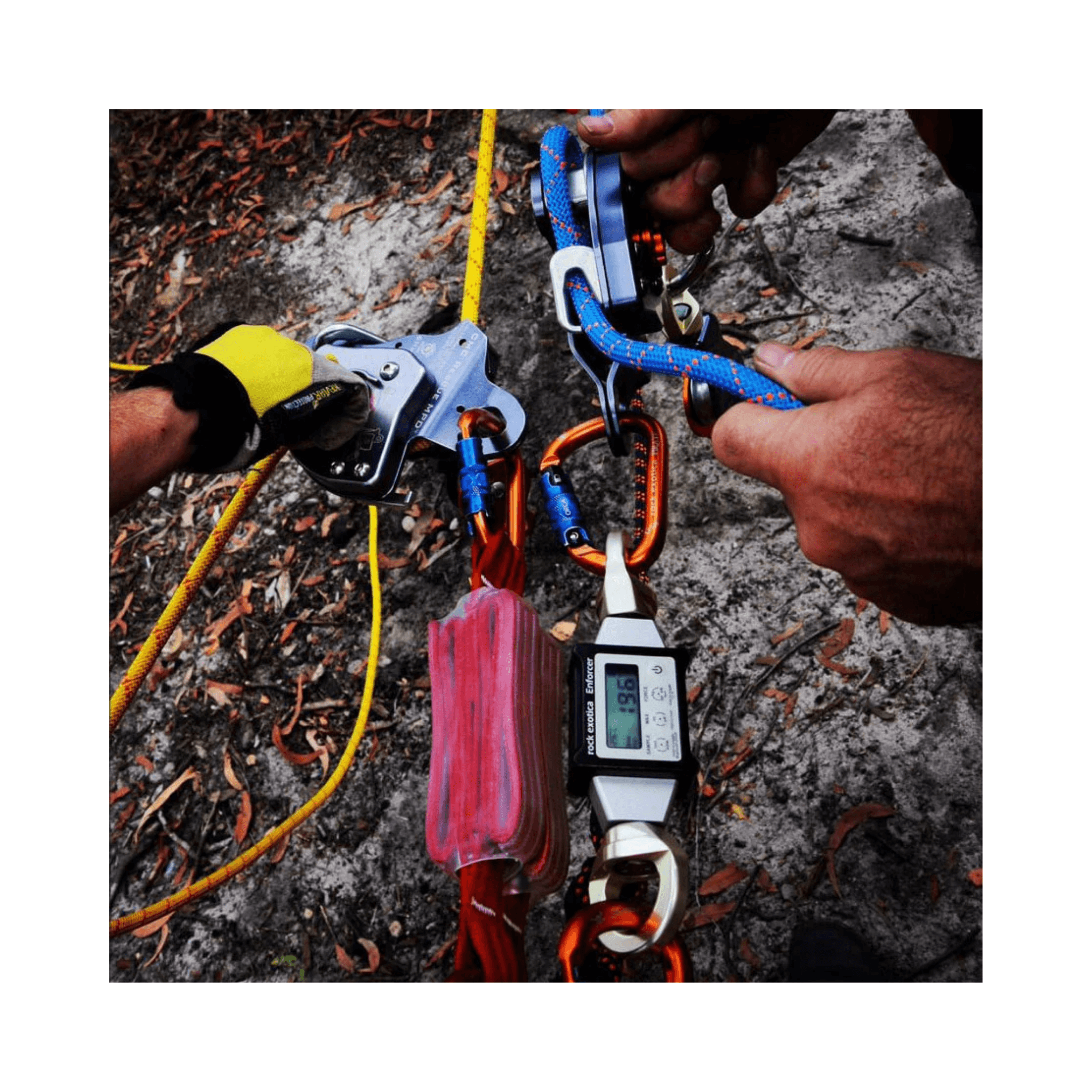 Hands using the Enforcer Load Cell & Case during a rigging operation for accurate force measurement.