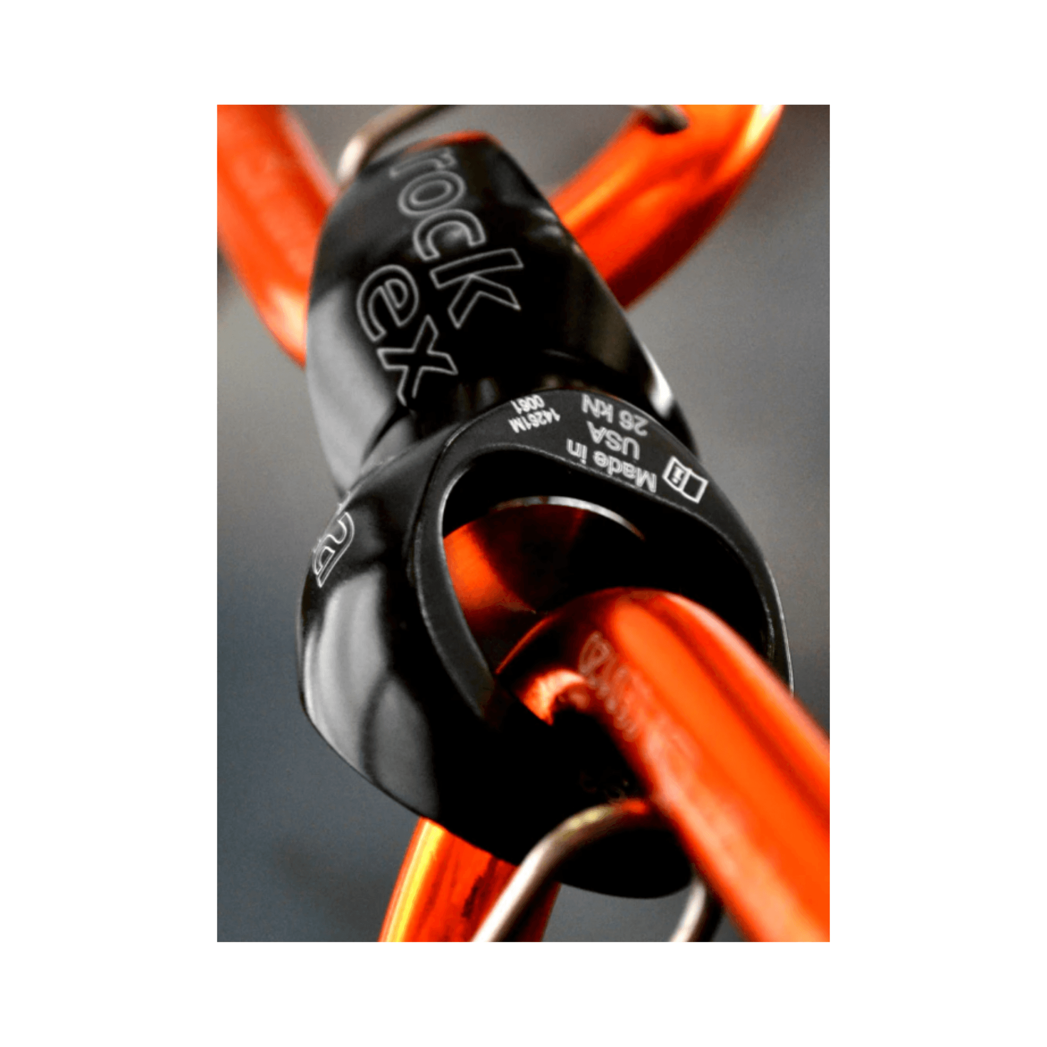 Rock Exotica Orbitor Swivel in use with orange connectors for efficient rigging and rope access.