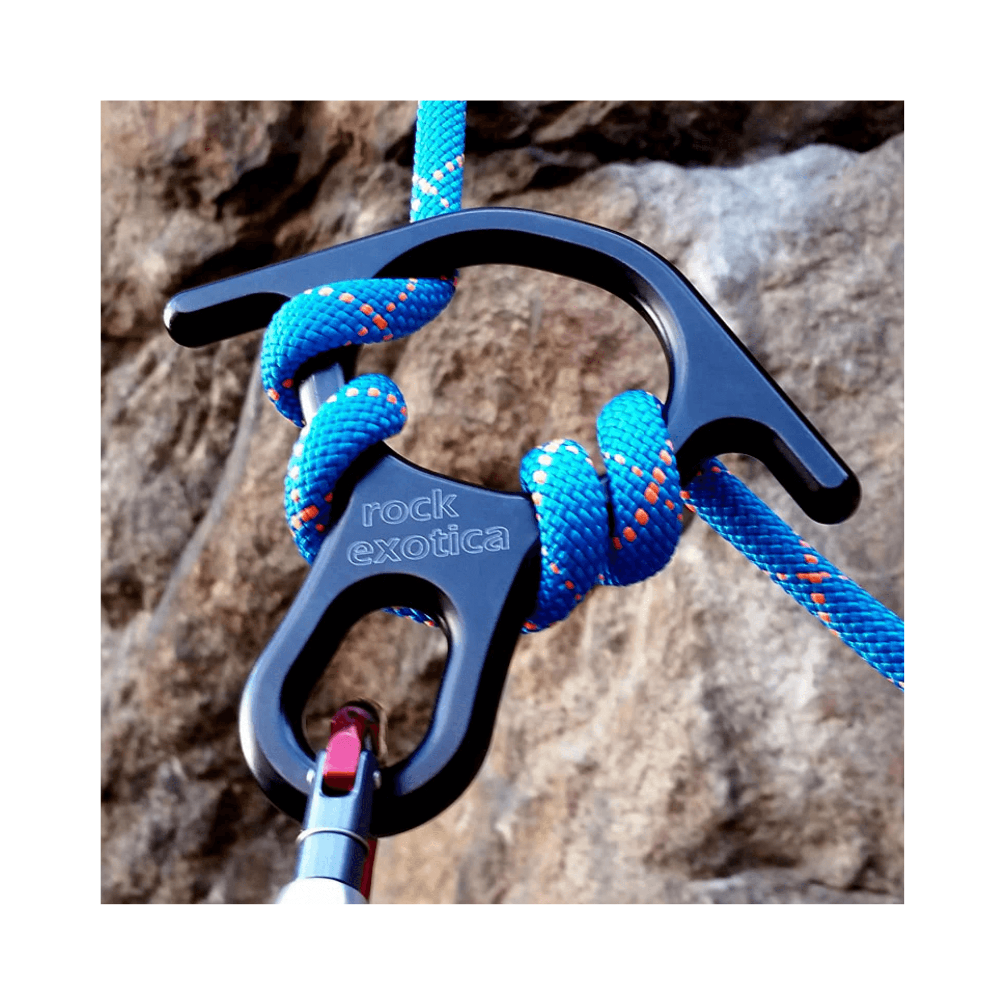 Rescue Eight Descender used with blue rope in a rock climbing setting for safety operations.
