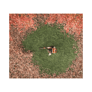 Person using the BRA 600 Cordless Backpack Leaf Blower to clear leaves from a lawn.