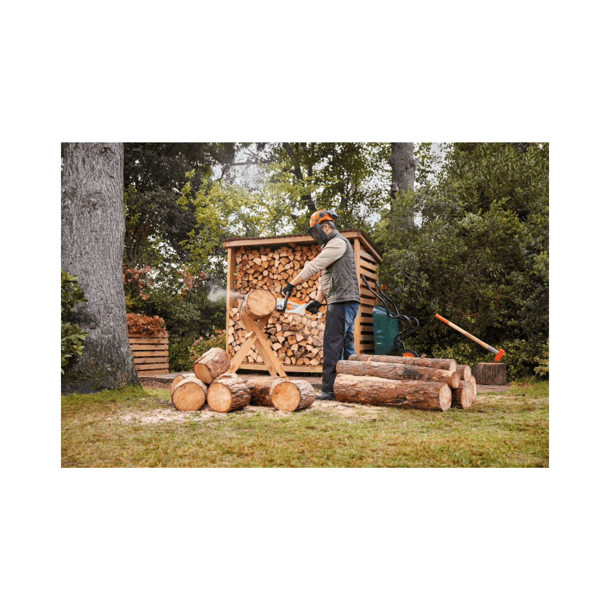 Man using STIHL MSA 80 C-B cordless chainsaw to cut firewood in a garden setting, ideal for homeowners and tree surgeons.