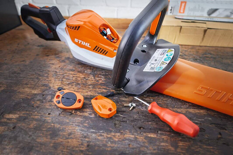 STIHL Smart Connector 2A with machine control tools on a wooden surface for tree surgeons.