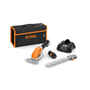 STIHL HSA 26 Cordless Shrub Grass Shears with interchangeable blades, a battery charger, and a black and orange STIHL carrying case.