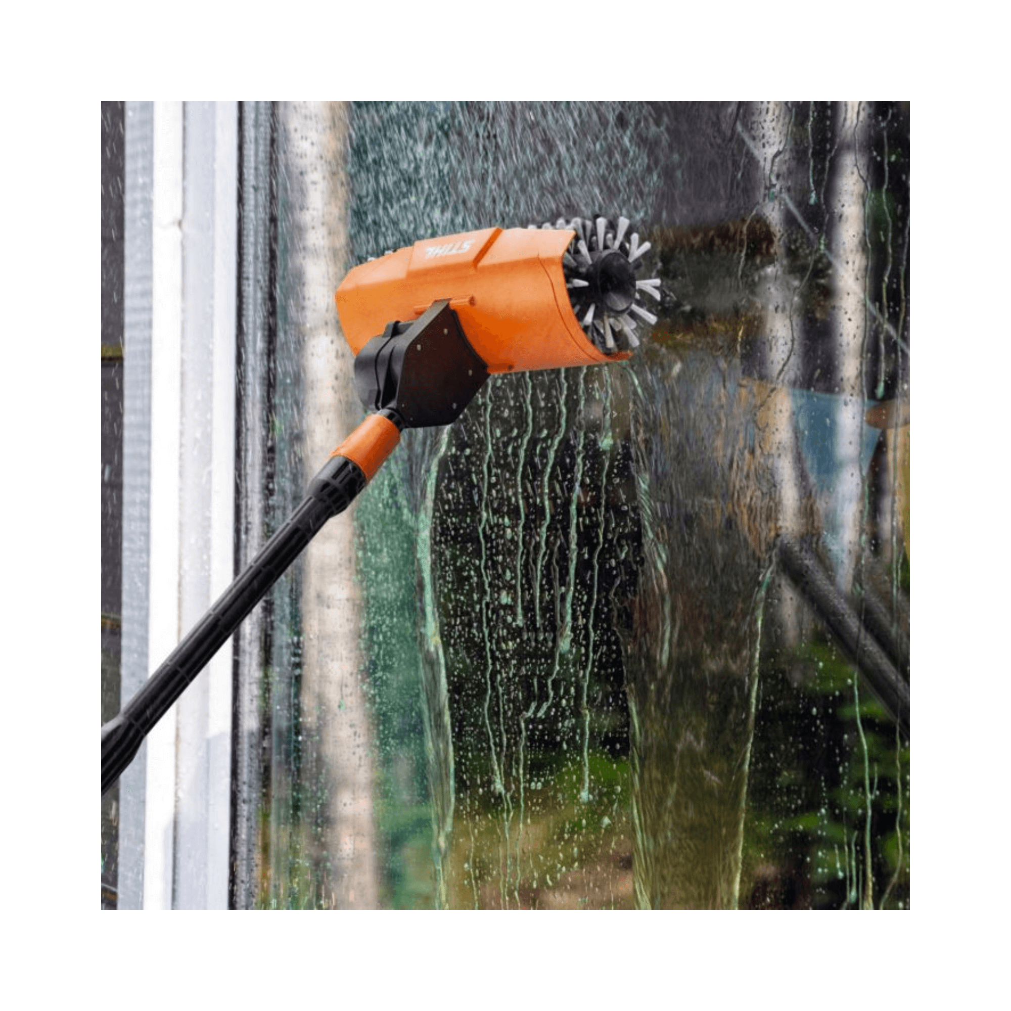 RE Pressure Washer Rotating Roller Brush cleaning a window for effective surface restoration.