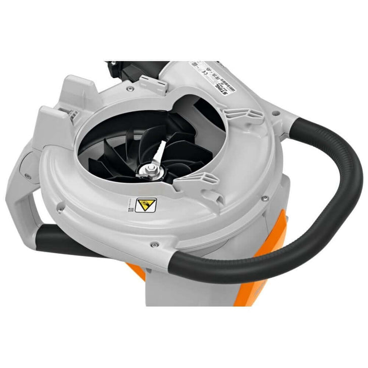 Close-up of the STIHL SHA 140 cordless leaf vacuum shredder's powerful motor and handle for tree surgeons.