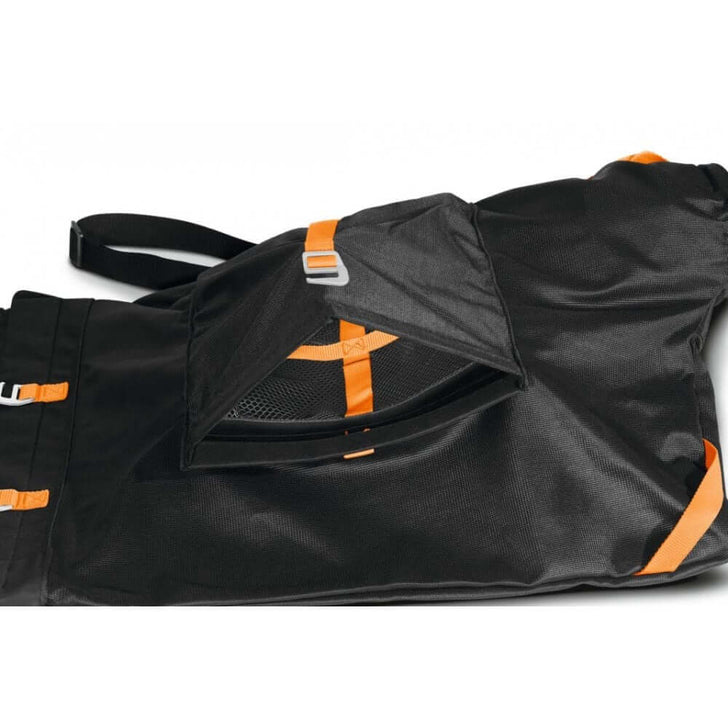 Close-up of STIHL vacuum shredder bag with mesh pocket and orange accents, designed for tree surgeons.