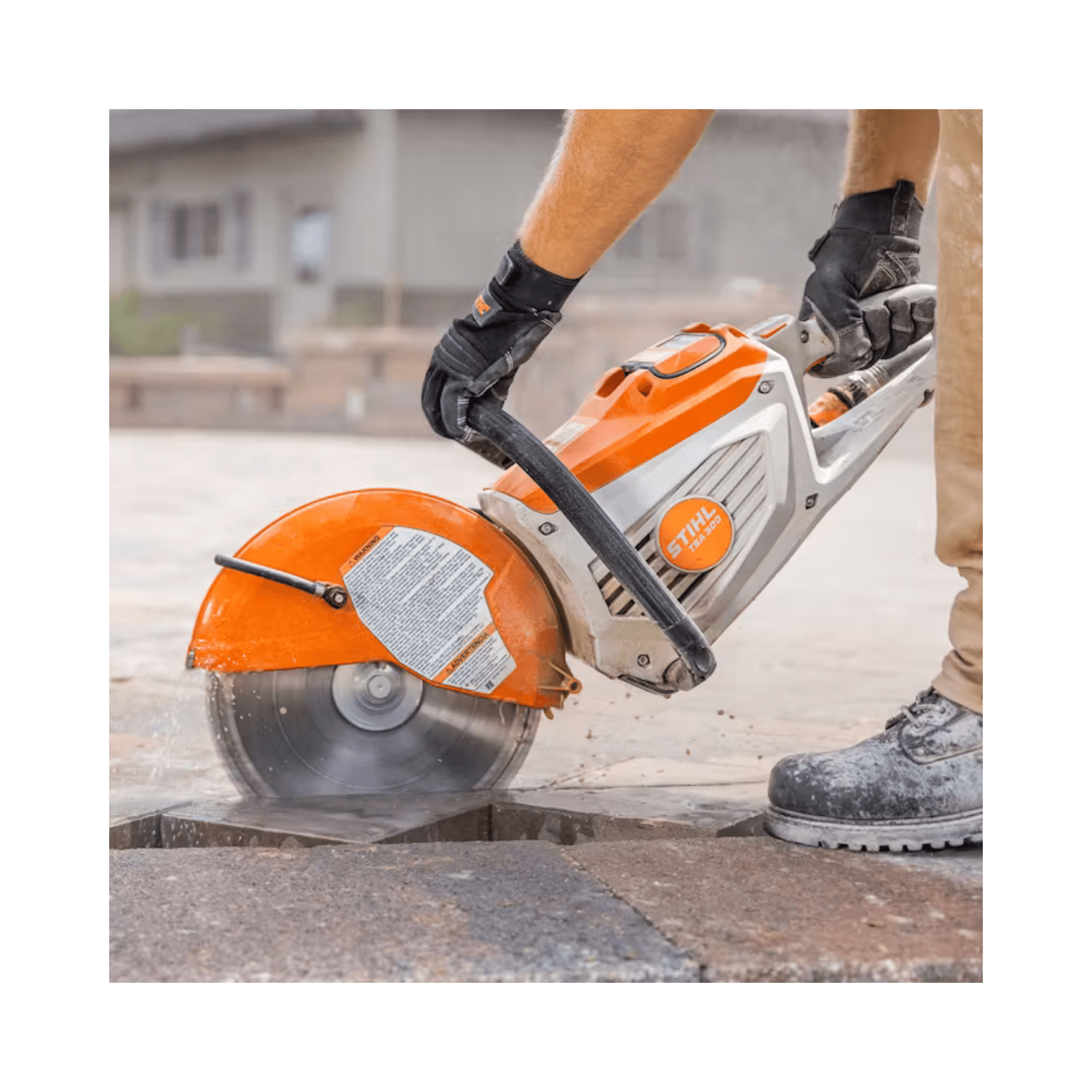 Person using a Stihl circular saw to cut stone