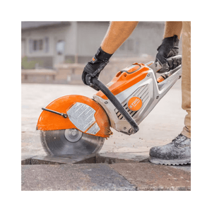 Person using a Stihl circular saw to cut stone
