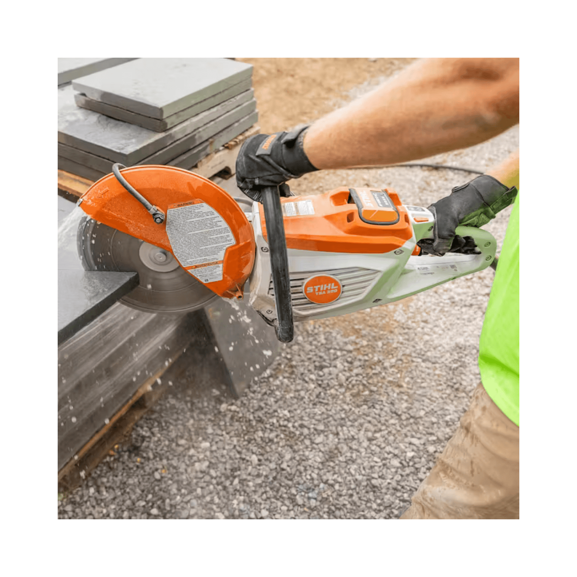Person using a Stihl circular saw to cut concrete.
