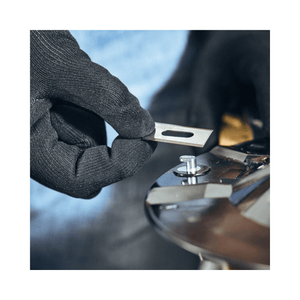 Hands in gloves installing a STIHL iMOW® DURO PLUS blade on a robotic mower for enhanced performance.