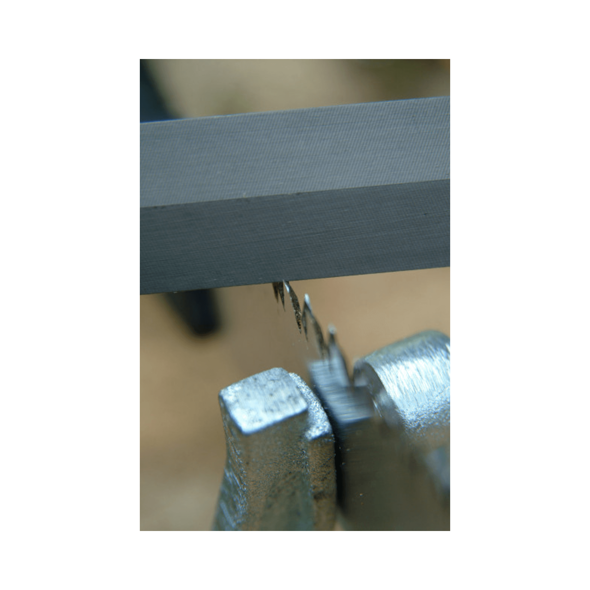 Silky Feather Edge File sharpening a Silky saw for optimal cutting performance.