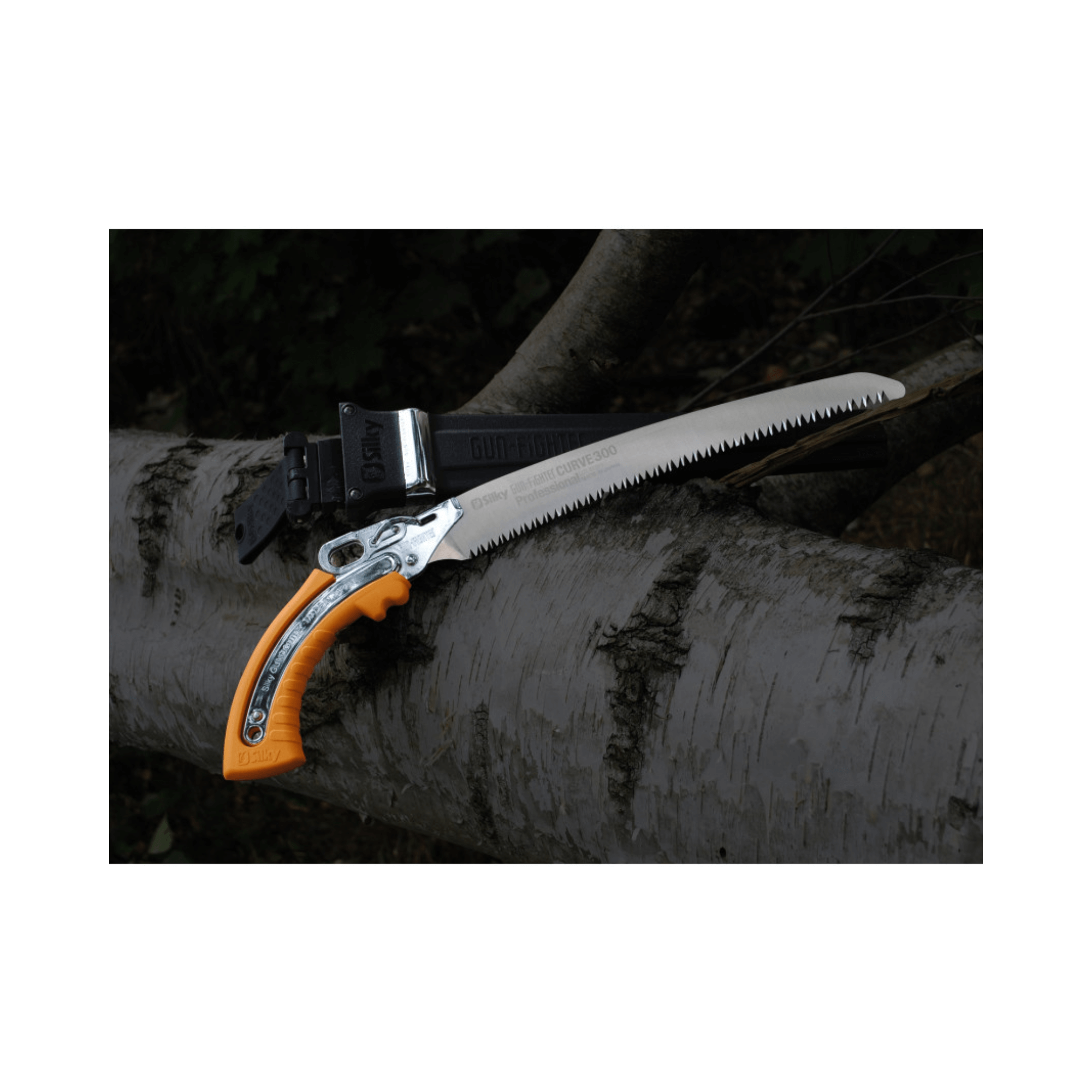 Gunfighter Curved Professional Pruning Saw resting on a log, showcasing its curved blade and ergonomic handle.