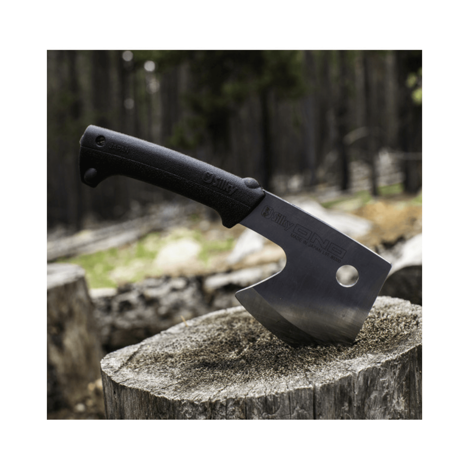 Ono 120 Axe displayed on a wooden stump, showcasing its premium steel blade and ergonomic handle.