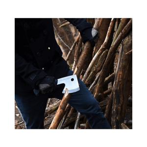 User demonstrating the Silky Ono 120 Axe in a wooded area, ideal for tree surgeons and outdoor enthusiasts.