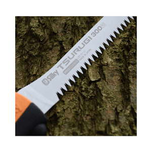 Silky Tsurugi Straight Hand Saw 300mm blade on tree bark, designed for tree surgeons and arborists.