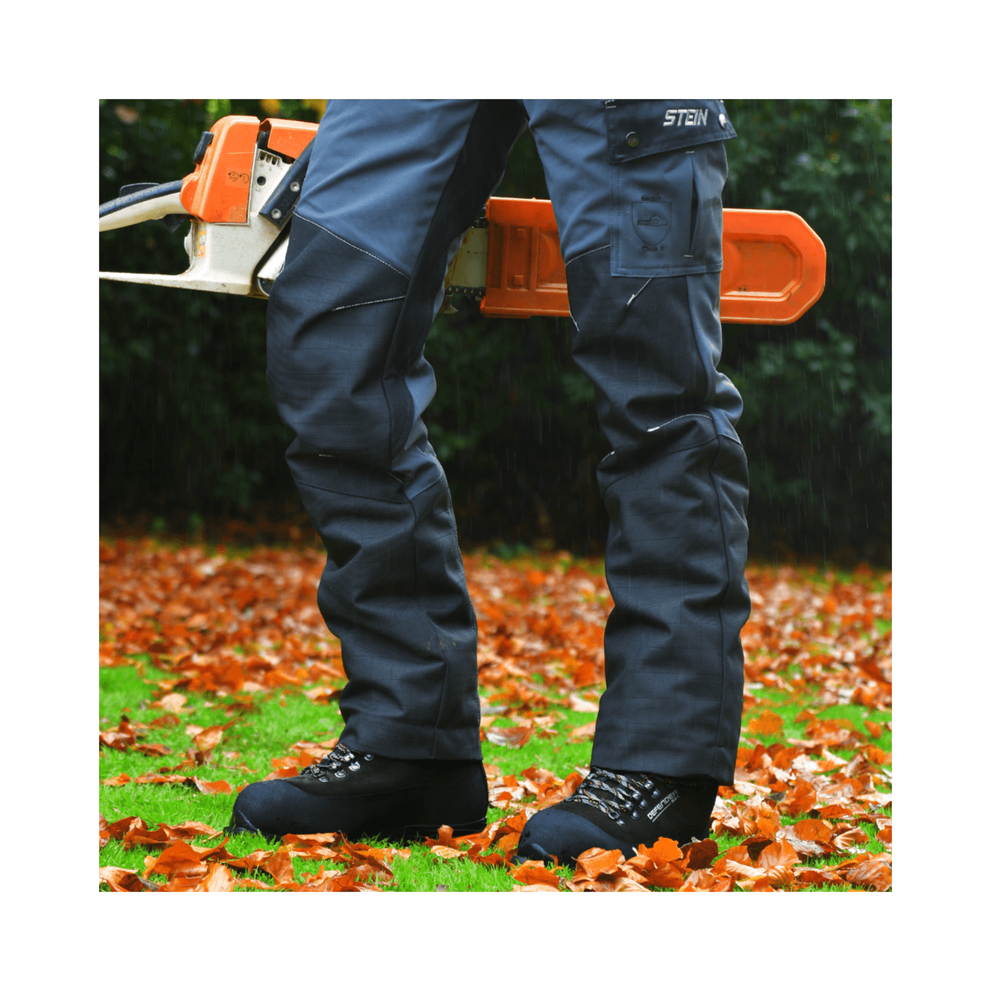 DEFENDER MAX V2 Black Chainsaw Boots Class 2 worn by a worker in the forest with autumn leaves.