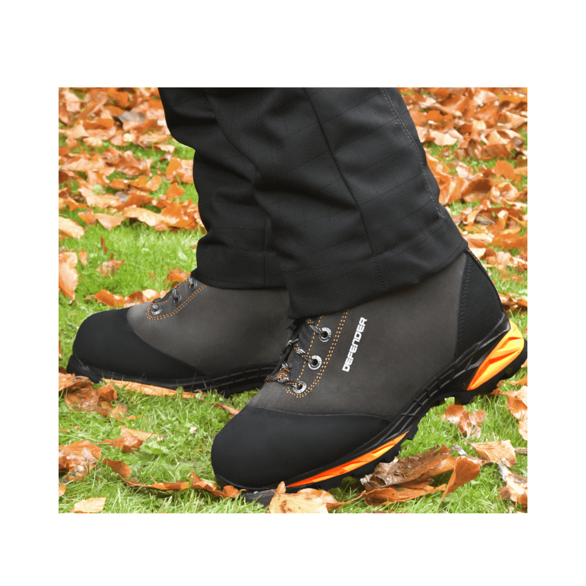 DEFENDER V2 Grey Chainsaw Boots Class 2 on display in an outdoor setting with autumn leaves.