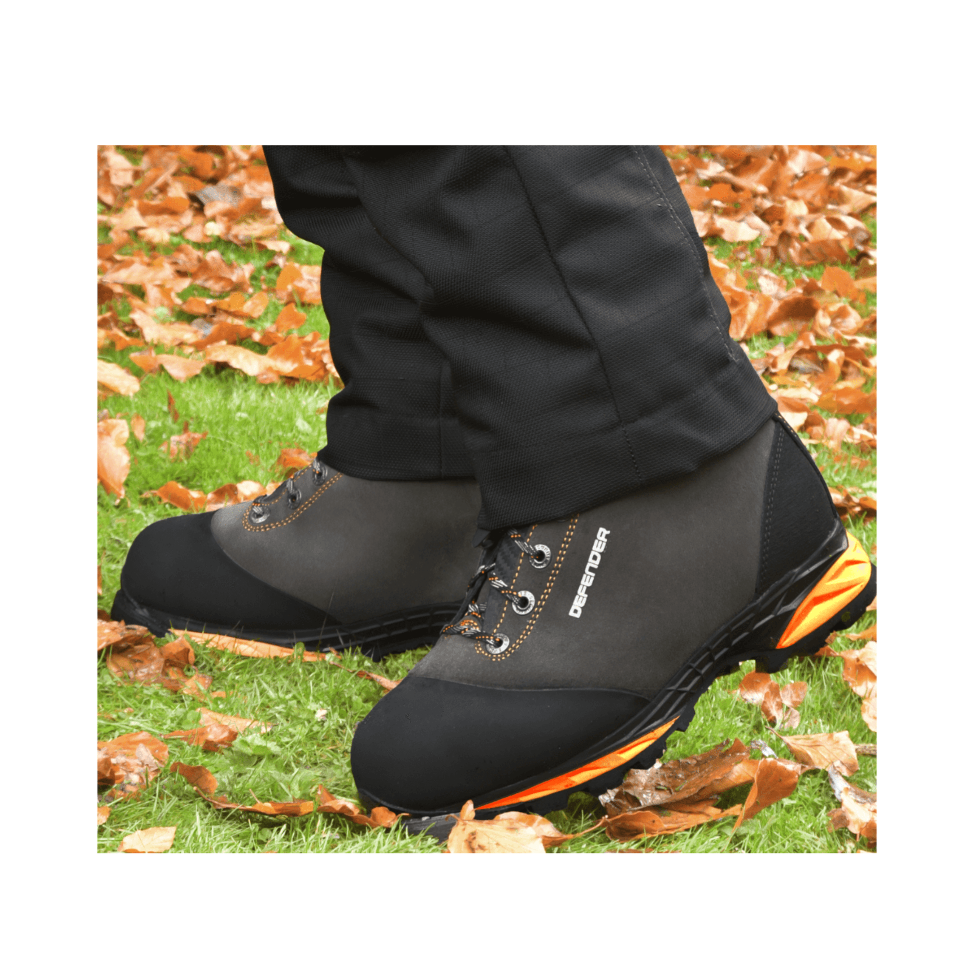 DEFENDER V2 Grey Chainsaw Boots Class 2 on display in an outdoor setting with autumn leaves.
