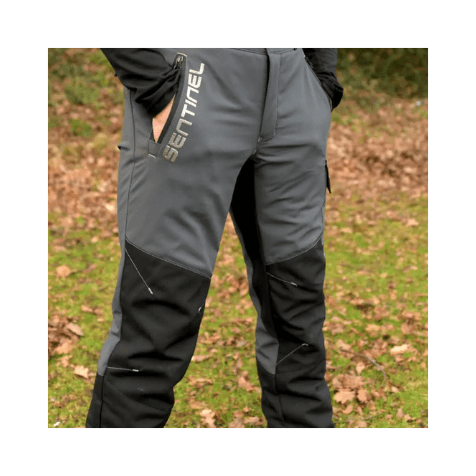 Sentinel Chainsaw Trousers Type A worn by a tree surgeon on a grassy background.