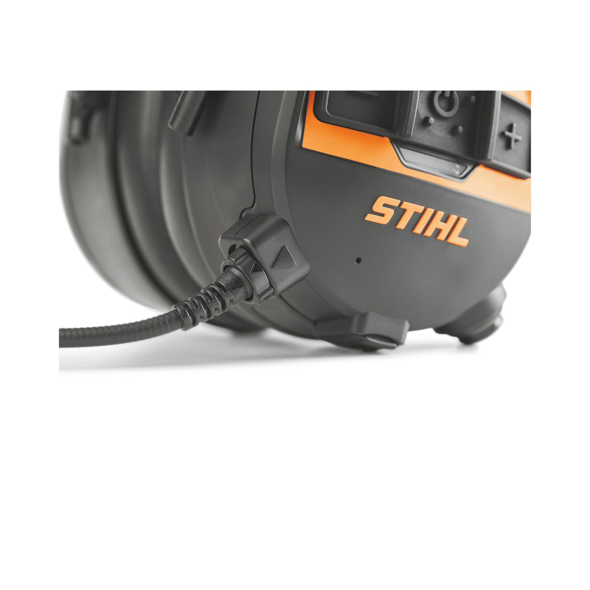 Close-up of STIHL Advance Procom Bluetooth helmet mounted ear defenders showing connection port and logo.