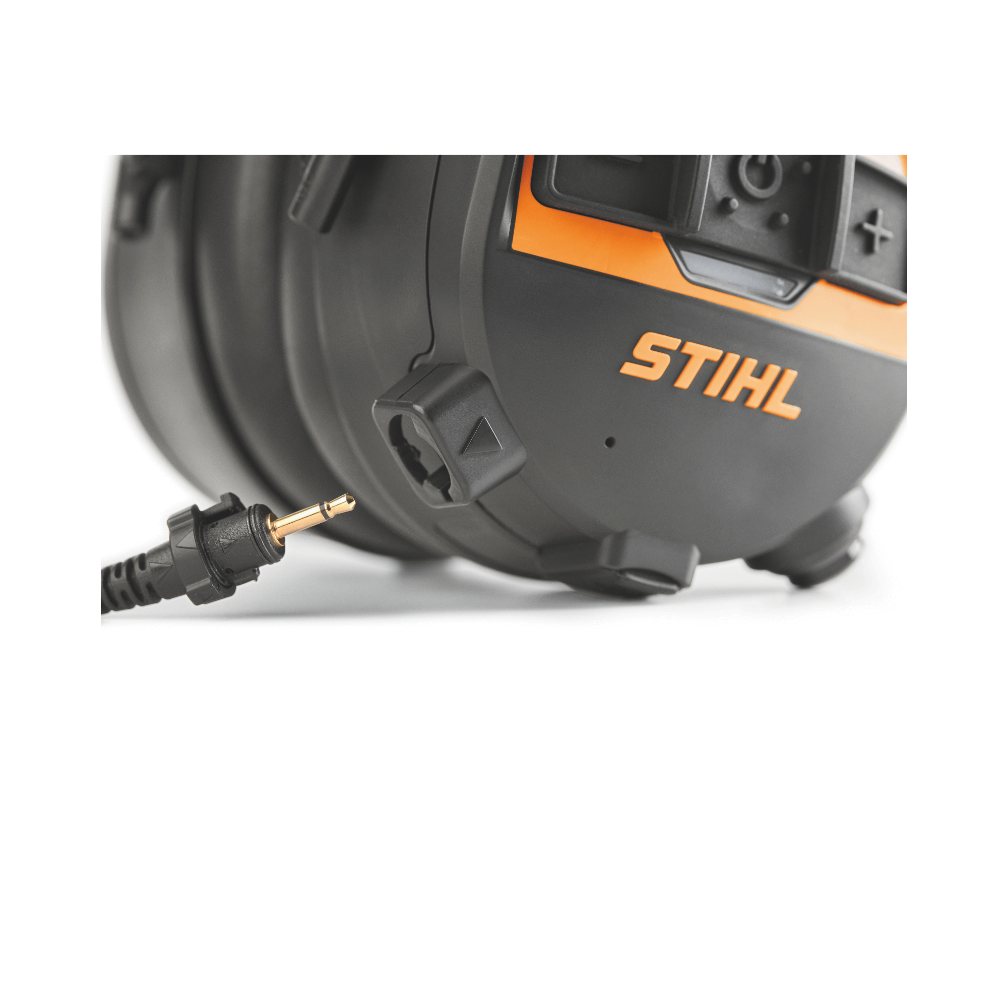 Close-up of STIHL Advance Procom Bluetooth helmet ear defenders showcasing connection port and logo.