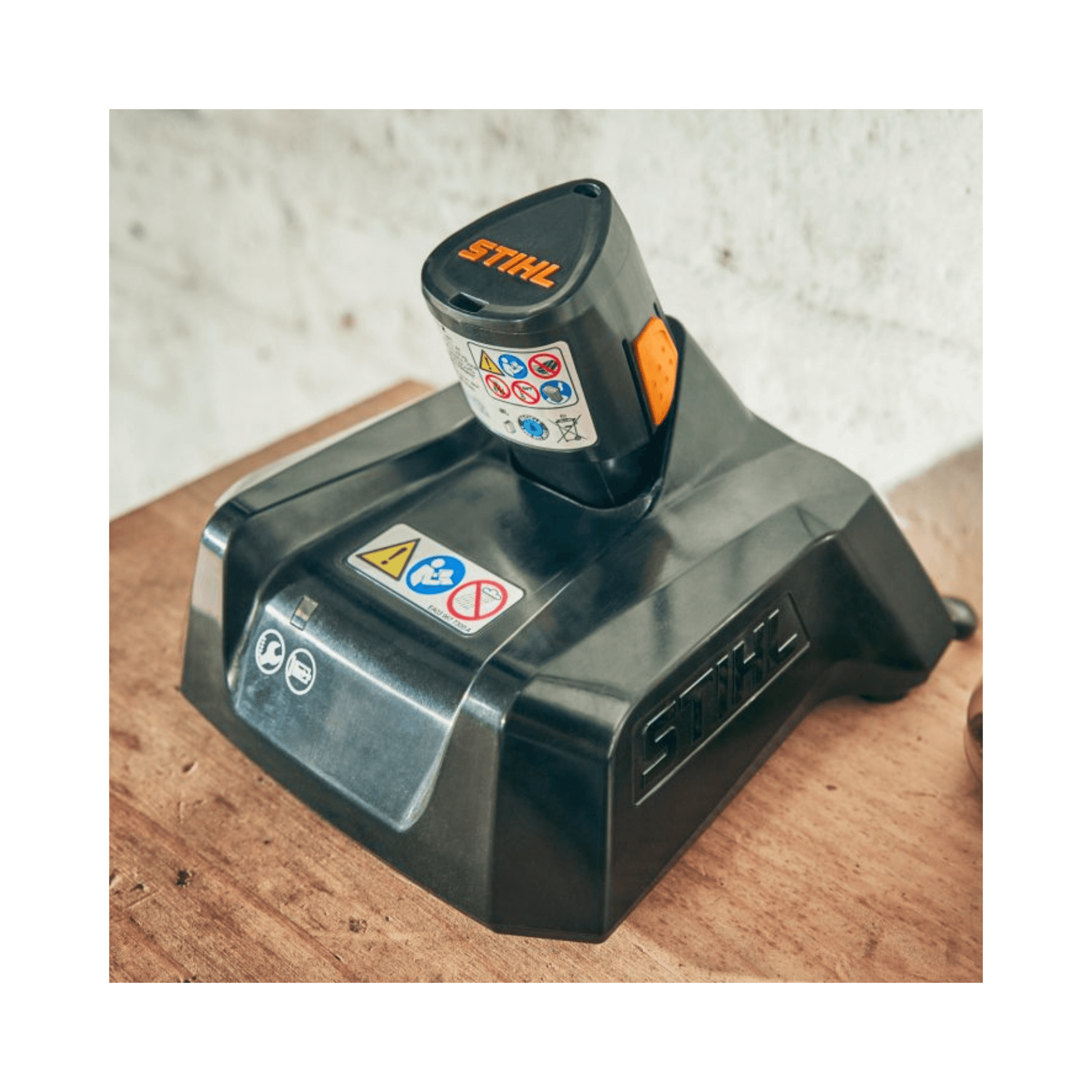 AL 1 Battery Charger on a workbench, designed for STIHL AS System batteries for tree surgeons.