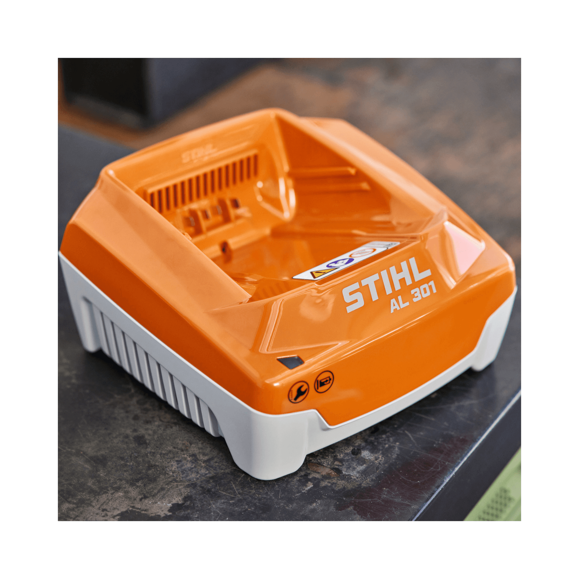 Stihl AL 301 battery charger on a dark surface